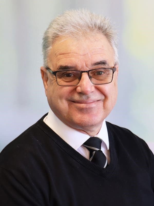 A professional headshot of Paul Bradley.