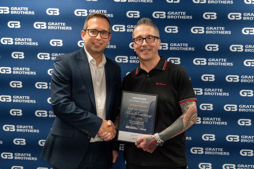 Mark Beauchamp receiving his award from David Gratte at the Excellence Awards 2025.