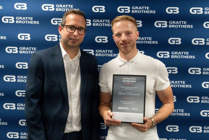 Lewis Danneau receiving his award from David Gratte at the Excellence Awards 2025.